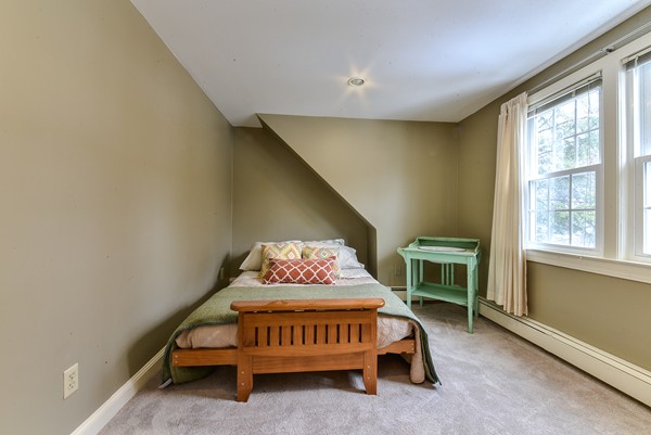 15 Charles Street Natick, MA 01760 - Photo 15 of 21 a bedroom with a bed and a window
