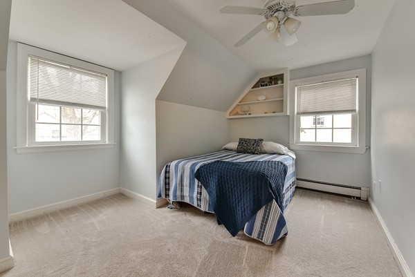 15 Charles Street Natick, MA 01760 - Photo 16 of 21 a bedroom with a bed and a window