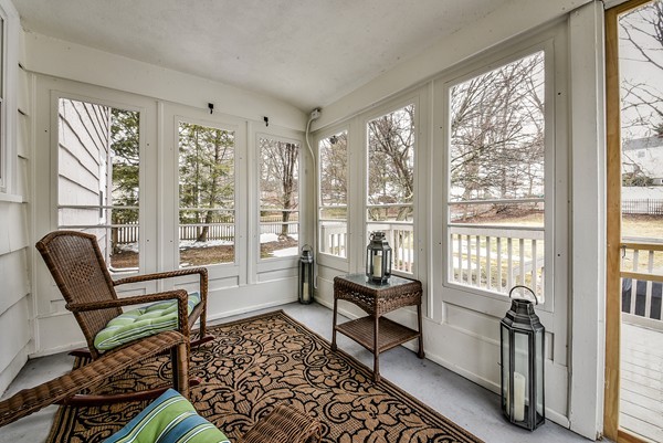15 Charles Street Natick, MA 01760 - Photo 18 of 21 a living room with furniture and a floor to ceiling window
