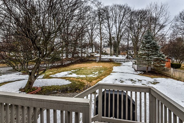 15 Charles Street Natick, MA 01760 - Photo 19 of 21 a view of a roof deck with wooden fence and floor