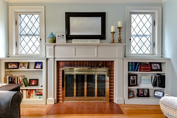 15 Charles Street Natick, MA 01760 - Photo 3 of 21 a living room with fireplace furniture and a window