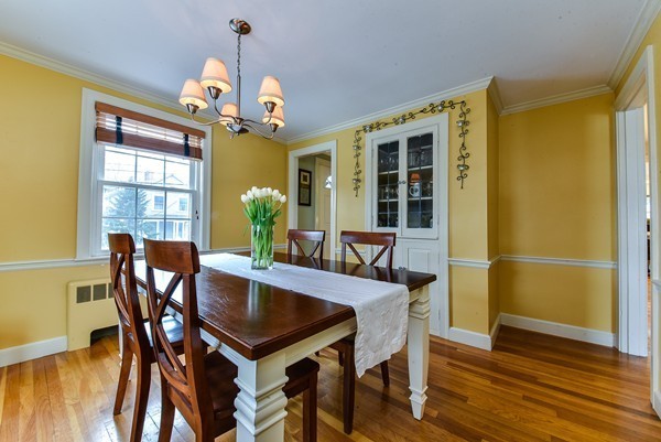 15 Charles Street Natick, MA 01760 - Photo 6 of 21 a dining room with furniture a chandelier and wooden floor