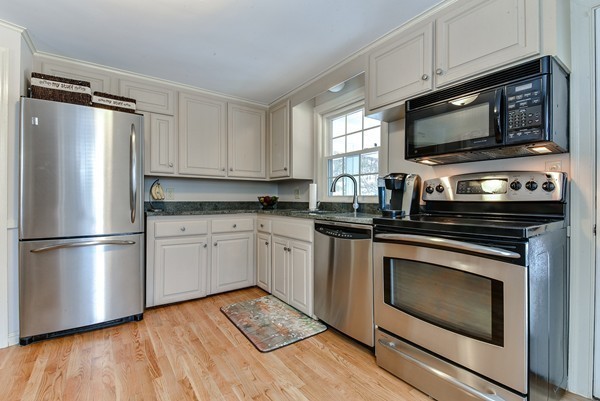 15 Charles Street Natick, MA 01760 - Photo 7 of 21 a kitchen with a refrigerator stove and microwave