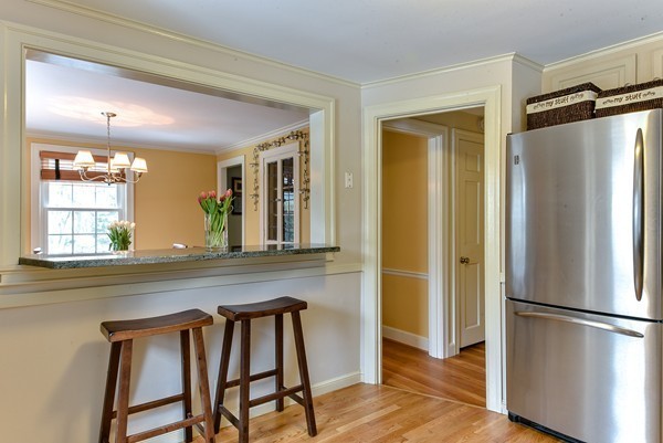 15 Charles Street Natick, MA 01760 - Photo 8 of 21 a kitchen with a refrigerator a sink and cabinets