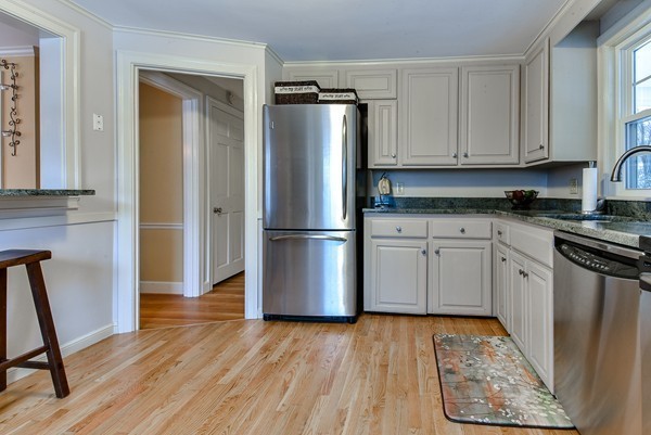 15 Charles Street Natick, MA 01760 - Photo 9 of 21 a kitchen with a refrigerator and a stove top oven