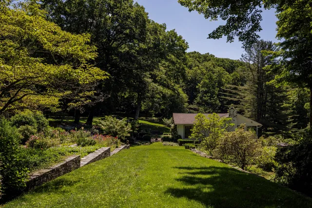 a view of backyard with swimming pool