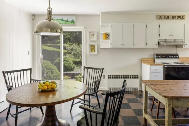 a living room with furniture a window and a fireplace