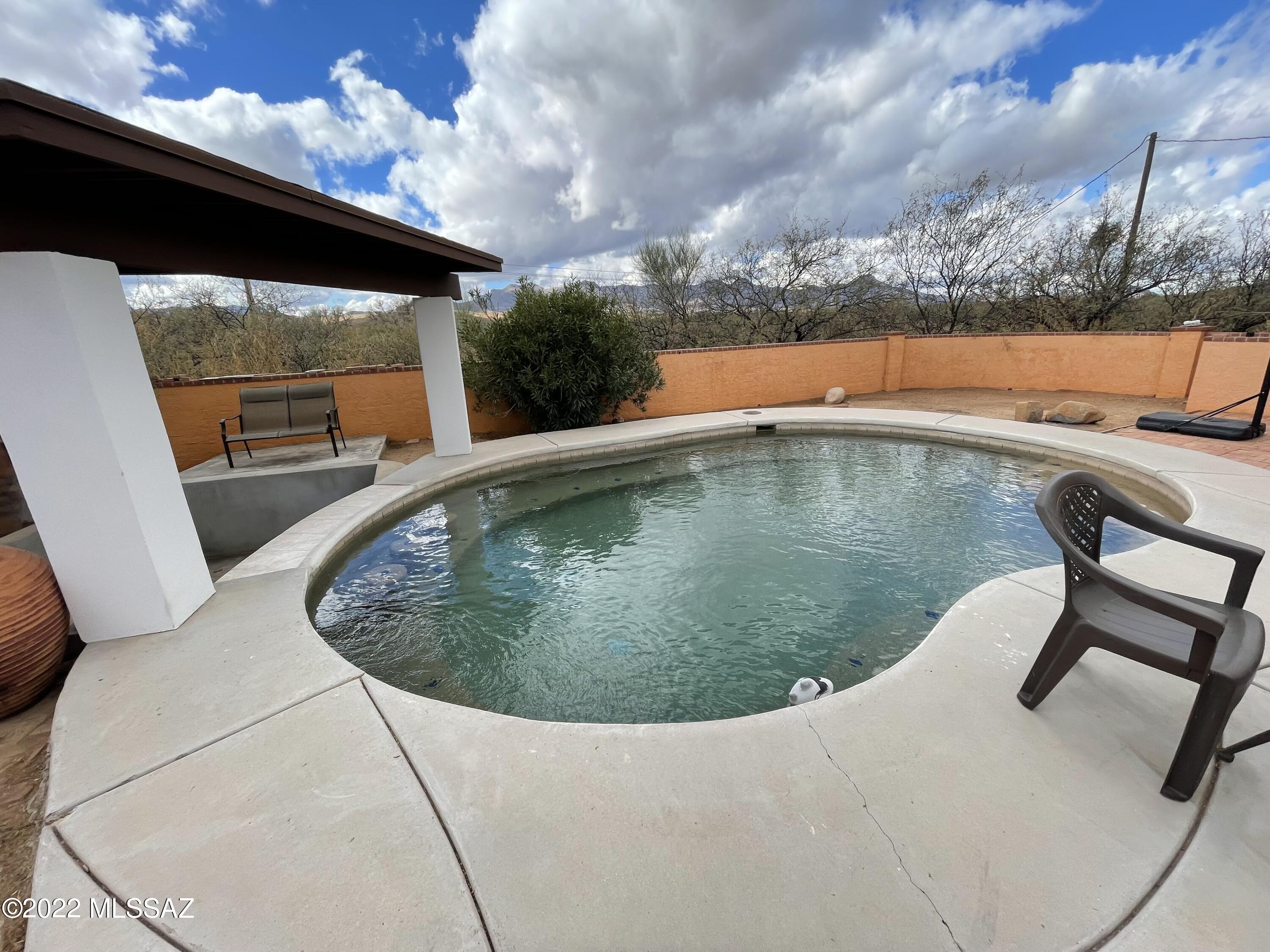 126 Avenida Ostion Rio Rico, AZ 85648 - Photo 28 of 31 a view of a swimming pool with an outdoor seating