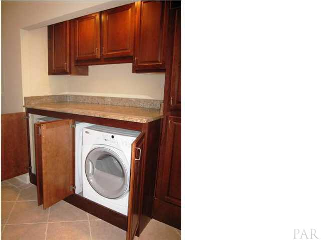 13335 Johnson Beach Road, Unit 802 Pensacola, FL 32507 - Photo 7 of 24 Concealed laundry which can also be used as an extra serving surface.