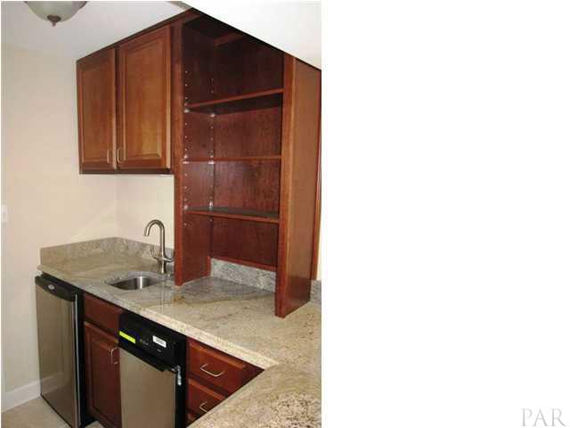 13335 Johnson Beach Road, Unit 802 Pensacola, FL 32507 - Photo 8 of 24 Front load washer & dryer behind paneled doors.
