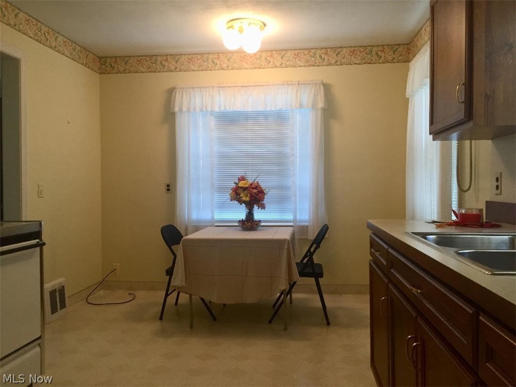 13812 Granger Road Cleveland, OH 44125 - Photo 3 of 29 This spacious dining area will accommodate additional cabinetry or a much larger dining table.