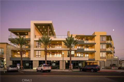 a couple of cars parked in front of a building