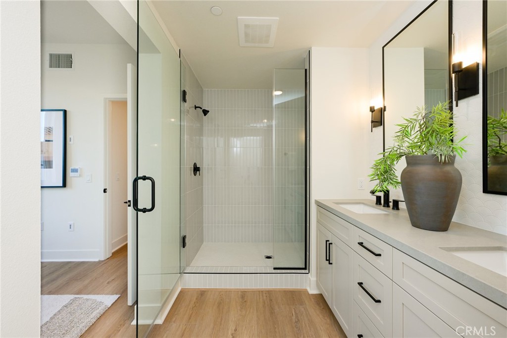 414 Main Street, Unit 400 Huntington Beach, CA 92648 - Photo 15 of 29 a bathroom with a shower
