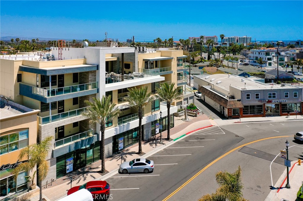 414 Main Street, Unit 400 Huntington Beach, CA 92648 - Photo 19 of 29 a city view with tall buildings