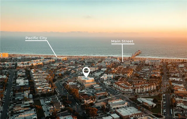 a kitchen with a sink a counter top space and stainless steel appliances