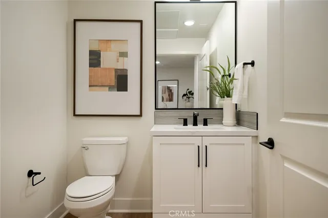 a bedroom with a bed and a lamp