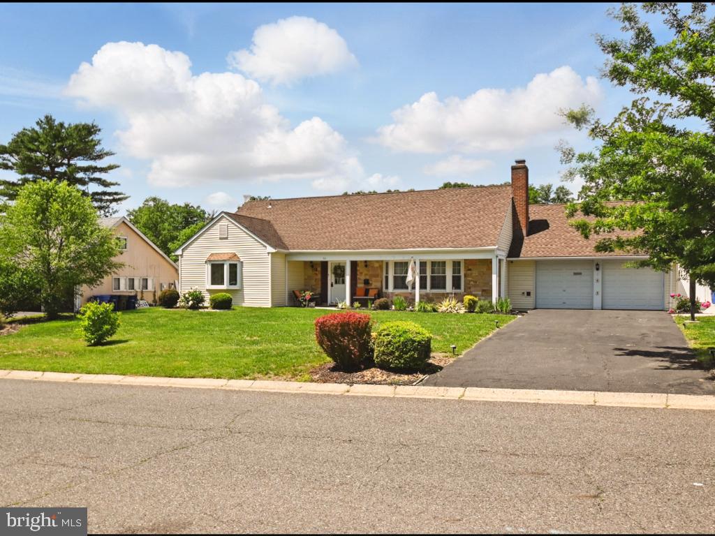 60 Windsor Lane Willingboro, NJ 08046 - Photo 14 of 58 a front view of a house with a yard and garage