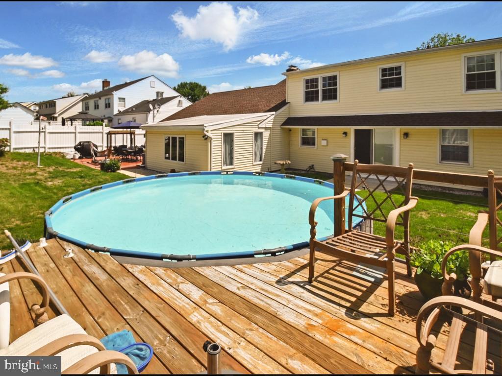 60 Windsor Lane Willingboro, NJ 08046 - Photo 20 of 58 a view of a house with backyard sitting area and swimming pool