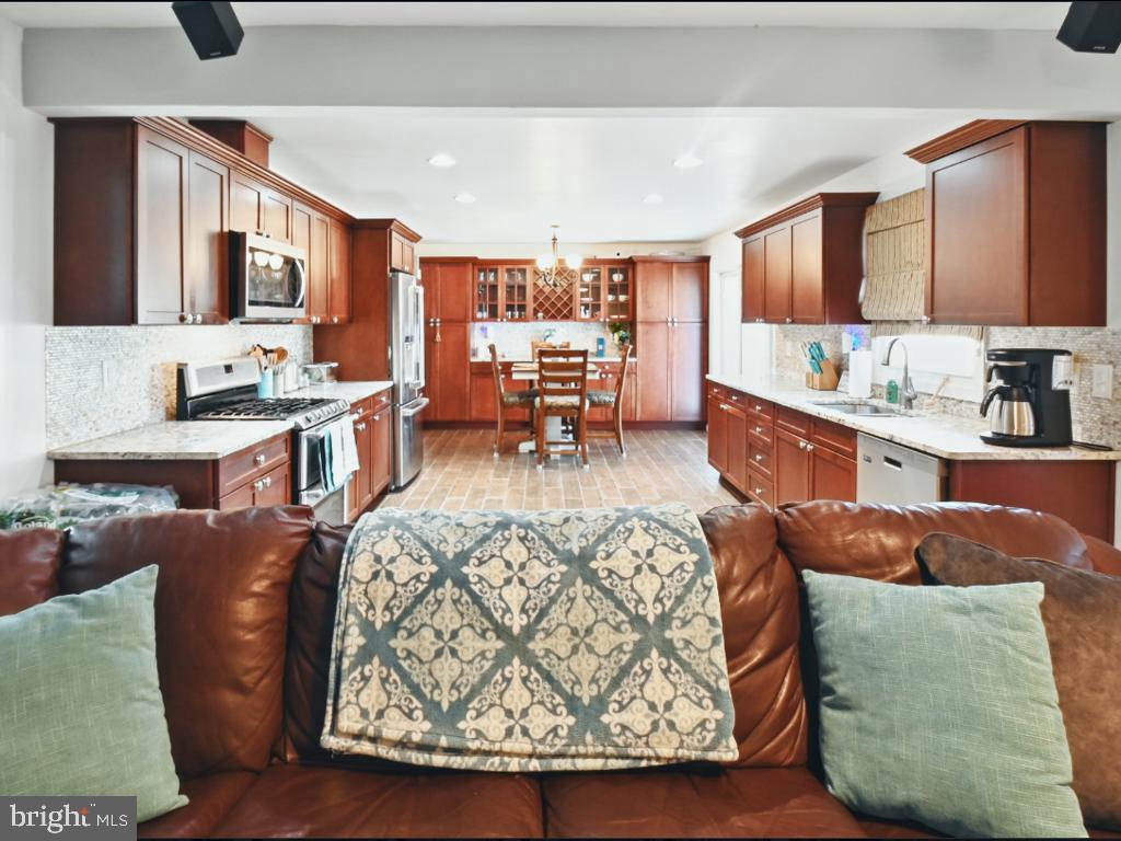 60 Windsor Lane Willingboro, NJ 08046 - Photo 28 of 58 a large living room with stainless steel appliances kitchen island granite countertop furniture and a kitchen view