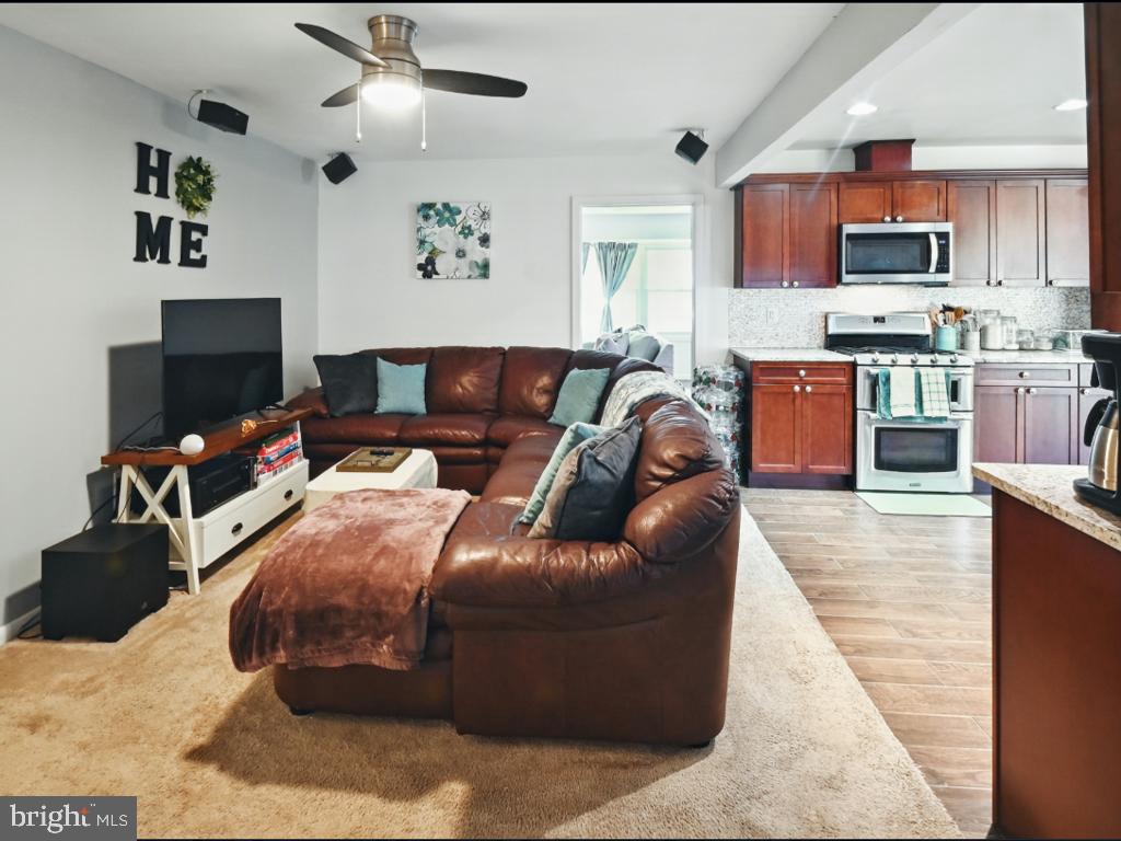 60 Windsor Lane Willingboro, NJ 08046 - Photo 37 of 58 a living room with furniture and a flat screen tv