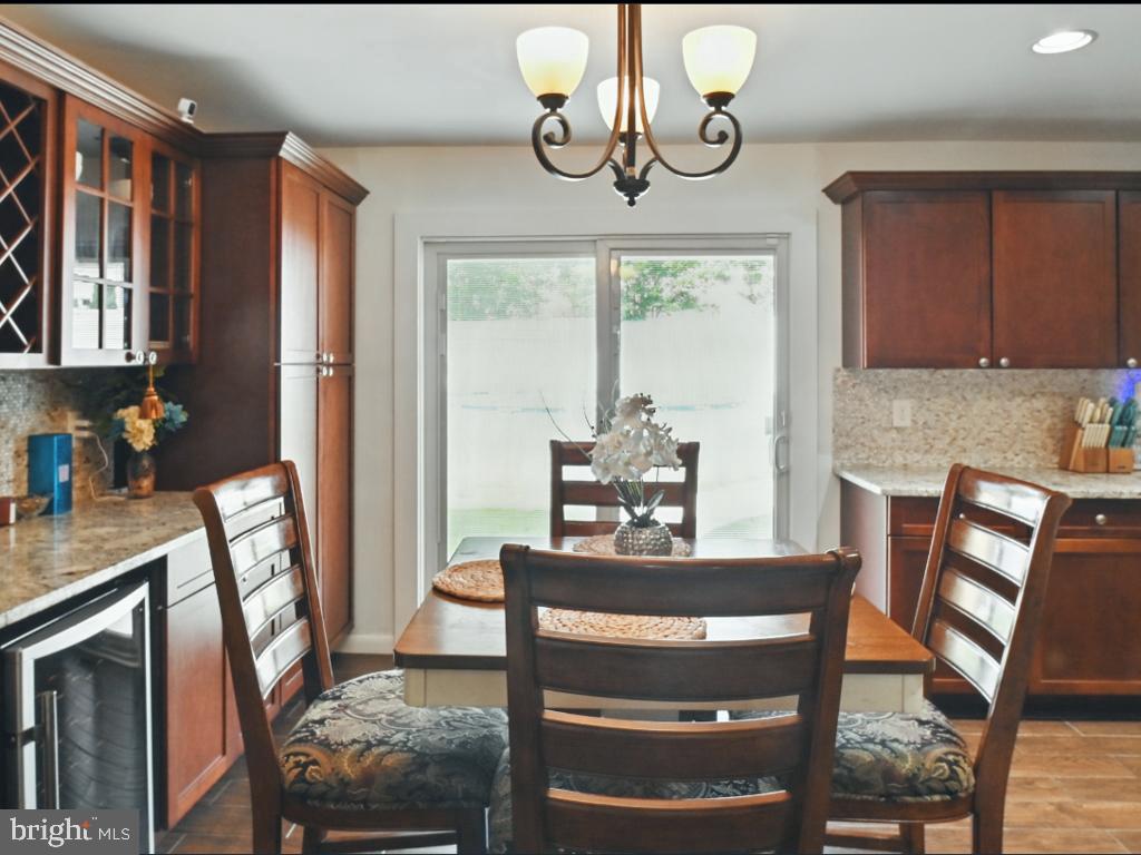 60 Windsor Lane Willingboro, NJ 08046 - Photo 38 of 58 a view of a dining room with furniture window and wooden floor