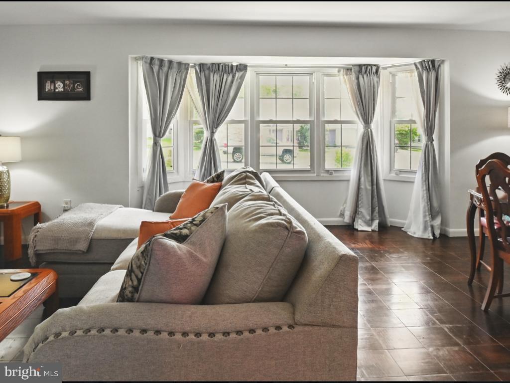 60 Windsor Lane Willingboro, NJ 08046 - Photo 39 of 58 a living room with furniture and a large window