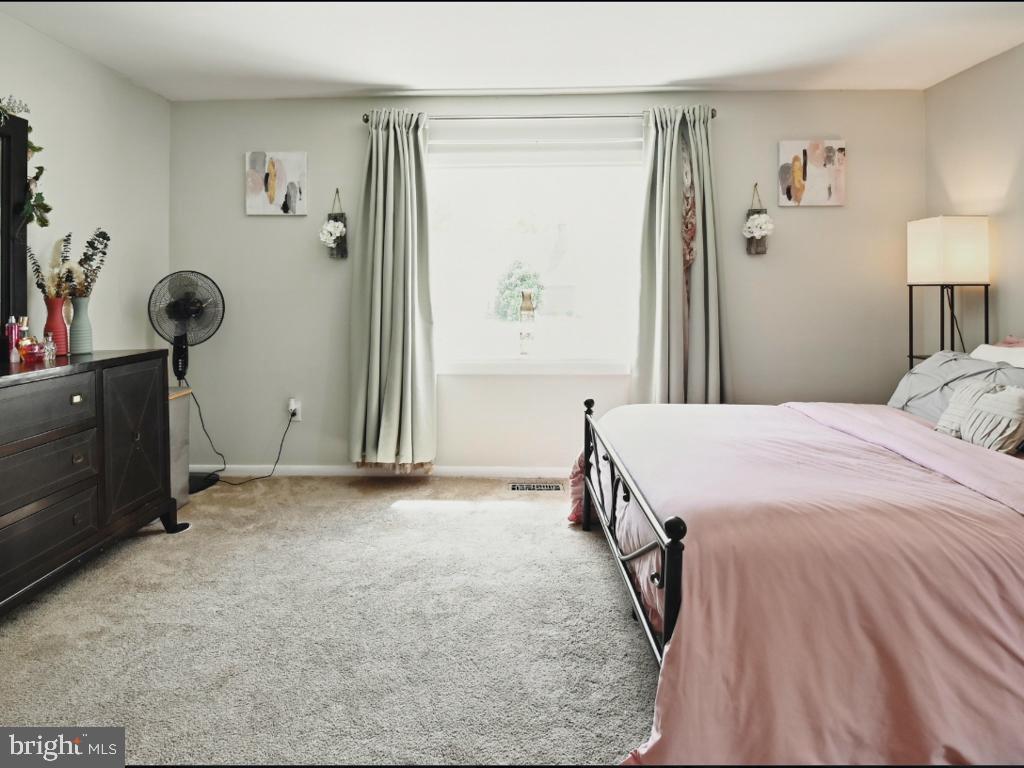 60 Windsor Lane Willingboro, NJ 08046 - Photo 46 of 58 a bedroom with a bed and a window