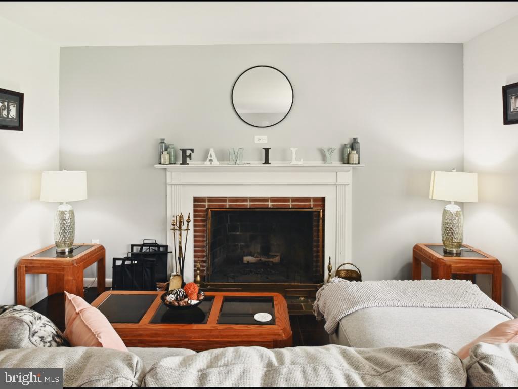 60 Windsor Lane Willingboro, NJ 08046 - Photo 49 of 58 a living room with furniture and a fireplace