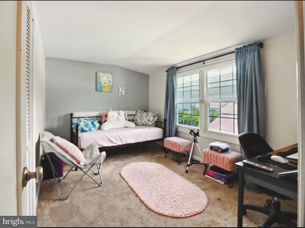 60 Windsor Lane Willingboro, NJ 08046 - Photo 50 of 58 a living room with furniture a table and a large window