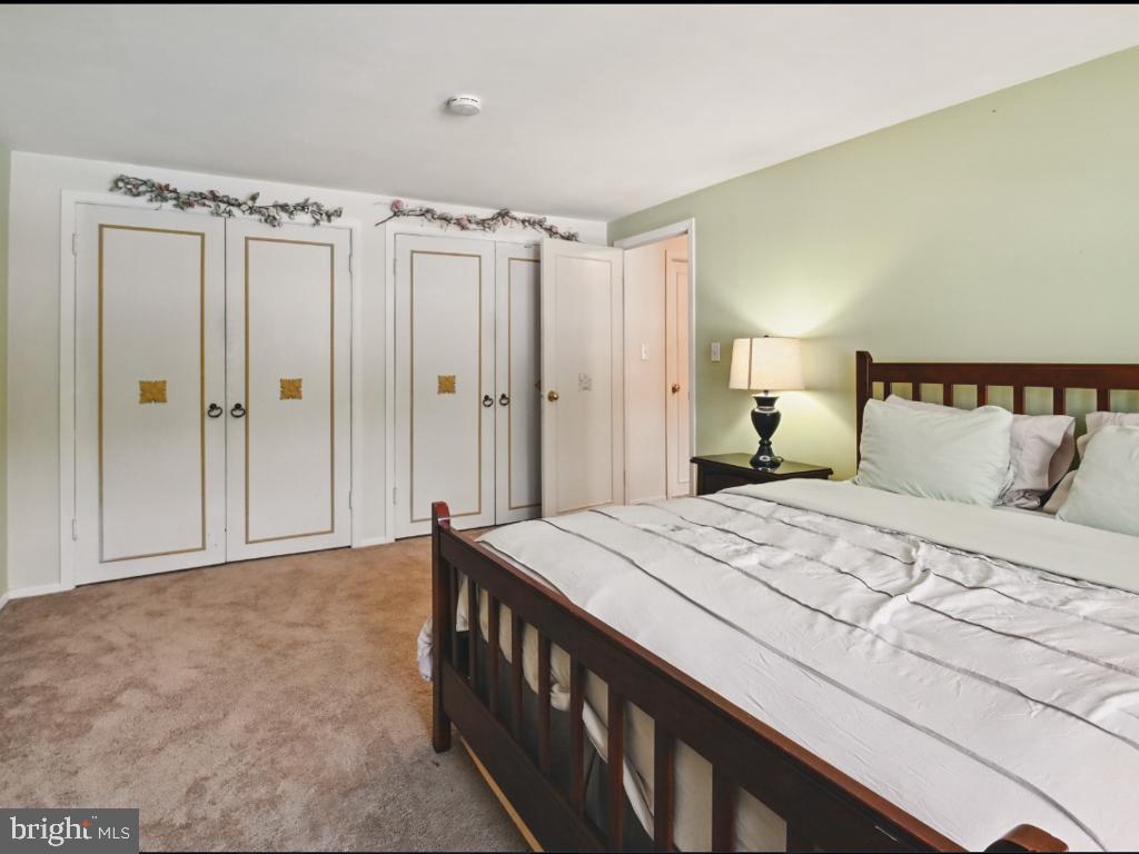 60 Windsor Lane Willingboro, NJ 08046 - Photo 51 of 58 a bedroom with a bed and a mirror