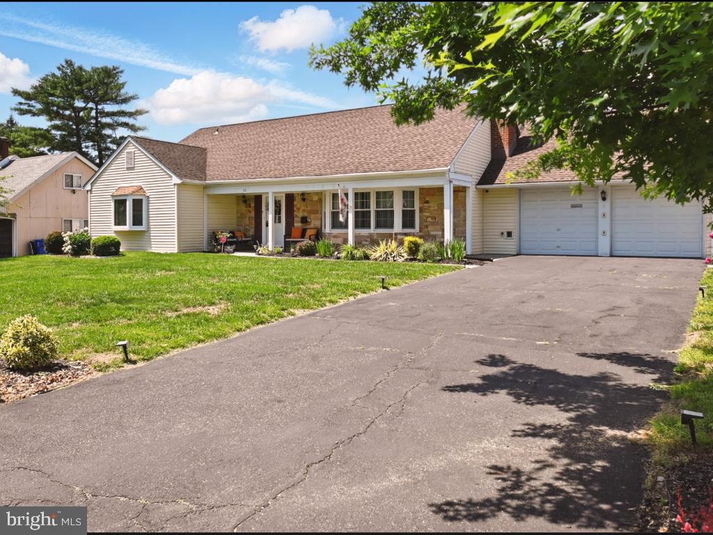 60 Windsor Lane Willingboro, NJ 08046 - Photo 9 of 58 a front view of a house with a yard and garage