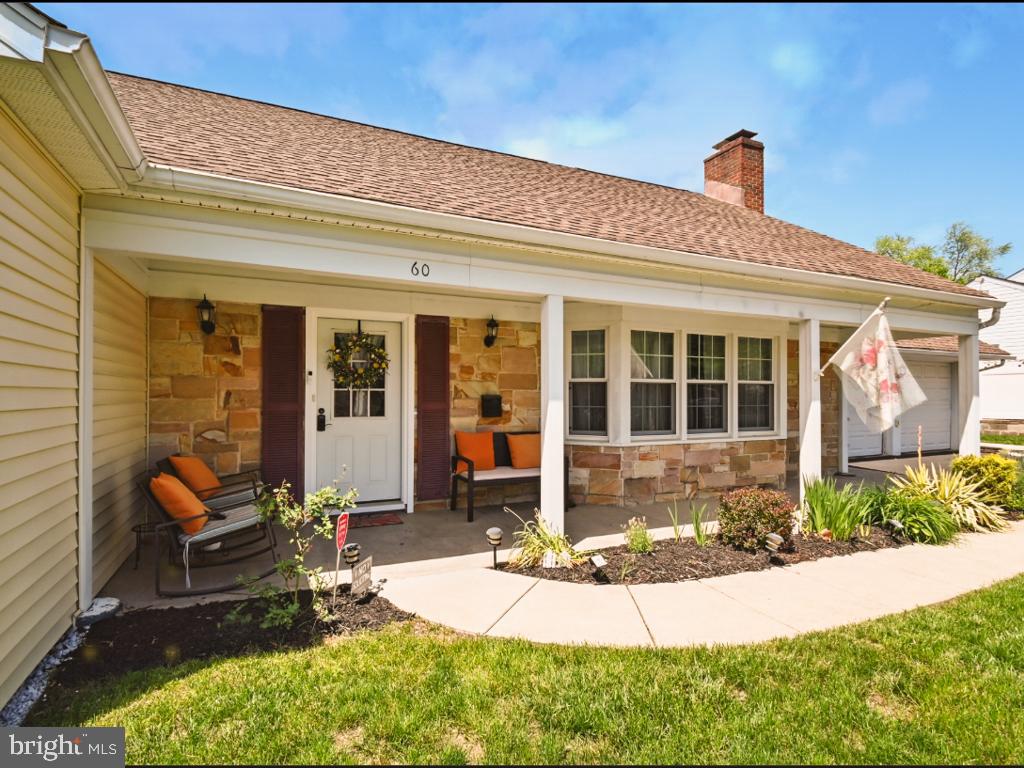 60 Windsor Lane Willingboro, NJ 08046 - Photo 10 of 58 a front view of a house with swimming pool and glass windows