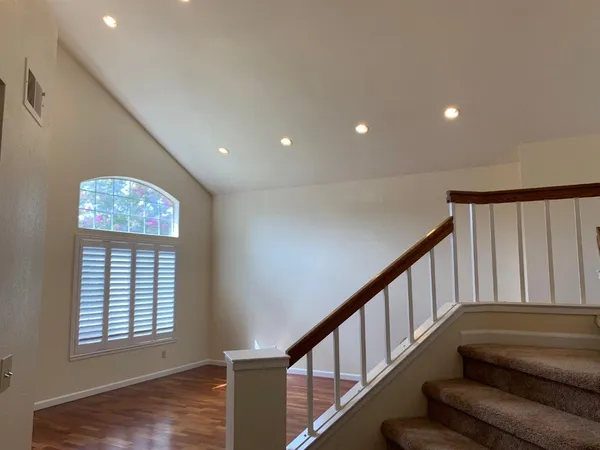 a view of entryway with stairs and wooden floor