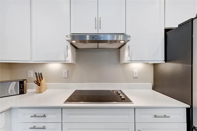 a bedroom with a bed and ceiling fan