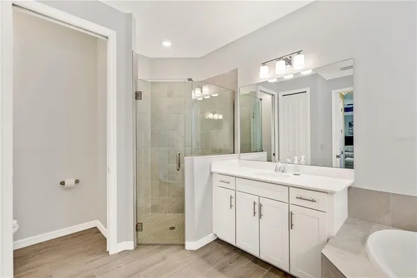 a utility room with sink dryer and washer