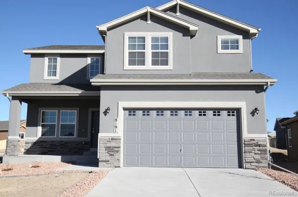 a front view of a house with a garage