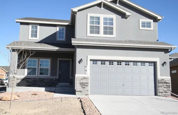 a front view of a house with a garage