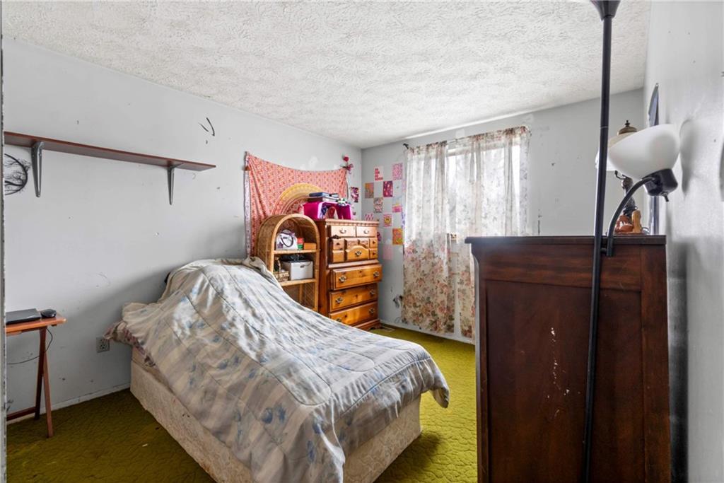 1781 Ivanhoe Drive Irwin, PA 15642 - Photo 19 of 35 a bedroom with a bed and dresser
