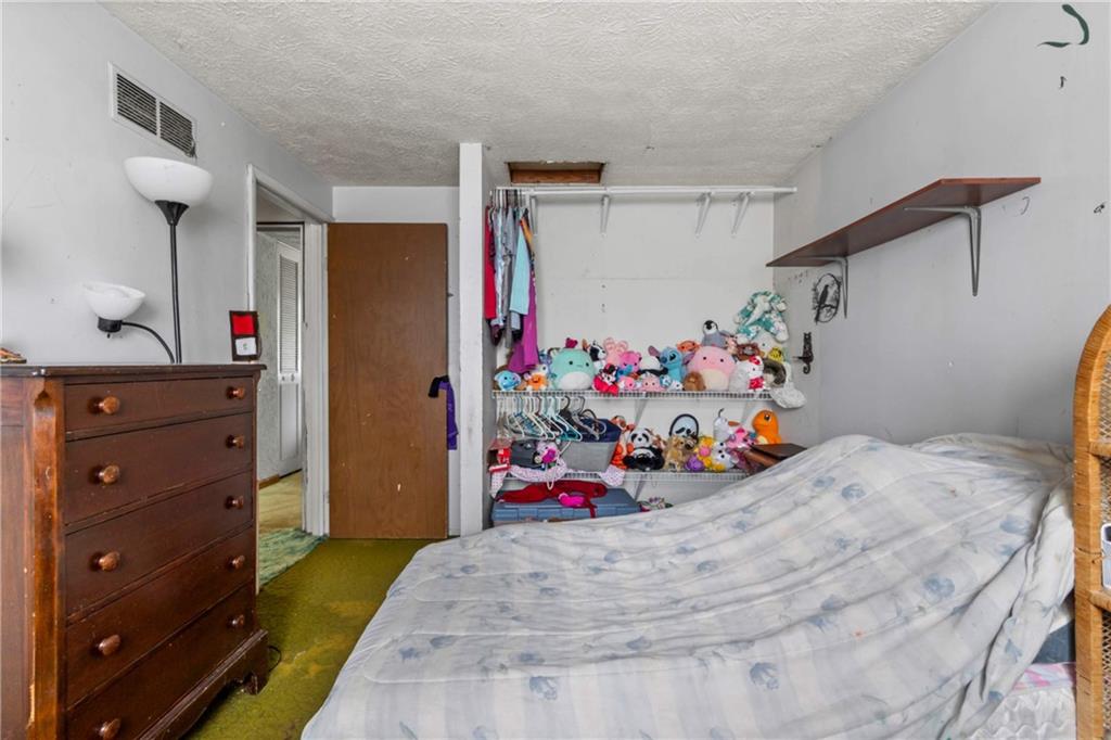 1781 Ivanhoe Drive Irwin, PA 15642 - Photo 20 of 35 a bedroom with a bed and a dresser