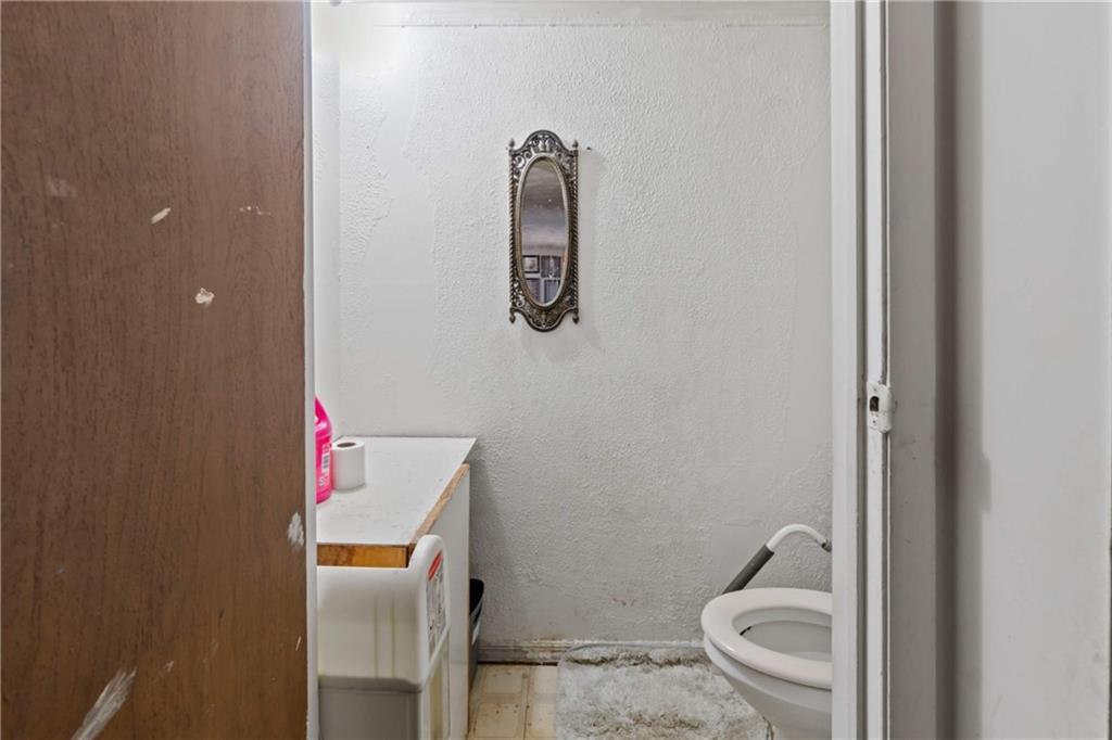 1781 Ivanhoe Drive Irwin, PA 15642 - Photo 23 of 35 a bathroom with a toilet and a sink