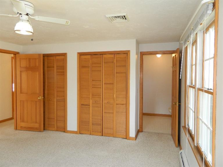 20 Millrace Road Marstons Mills, MA 02648 - Photo 25 of 32 wooden floor in an empty room with a window