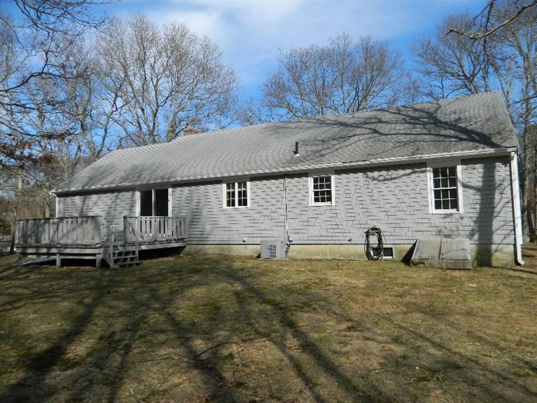 20 Millrace Road Marstons Mills, MA 02648 - Photo 5 of 32 a house that has a tree in front of it