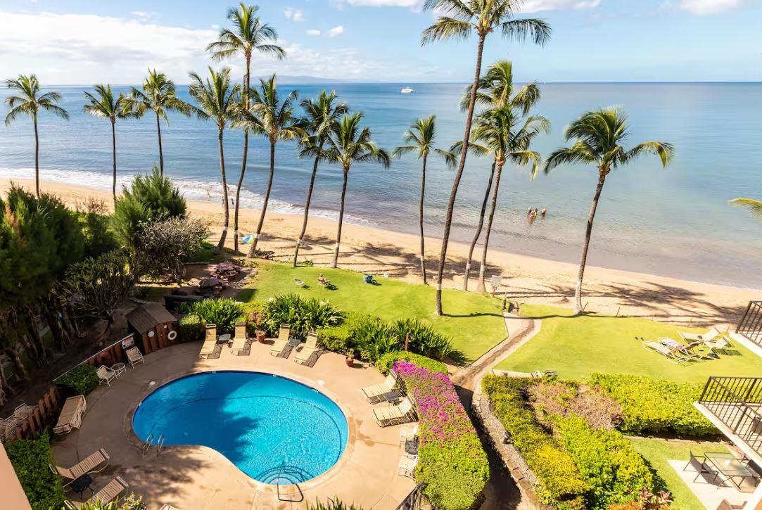 191 North Kihei Road, Unit 502 Kihei, HI 96753 - Photo 2 of 37 a swimming pool with lawn chairs