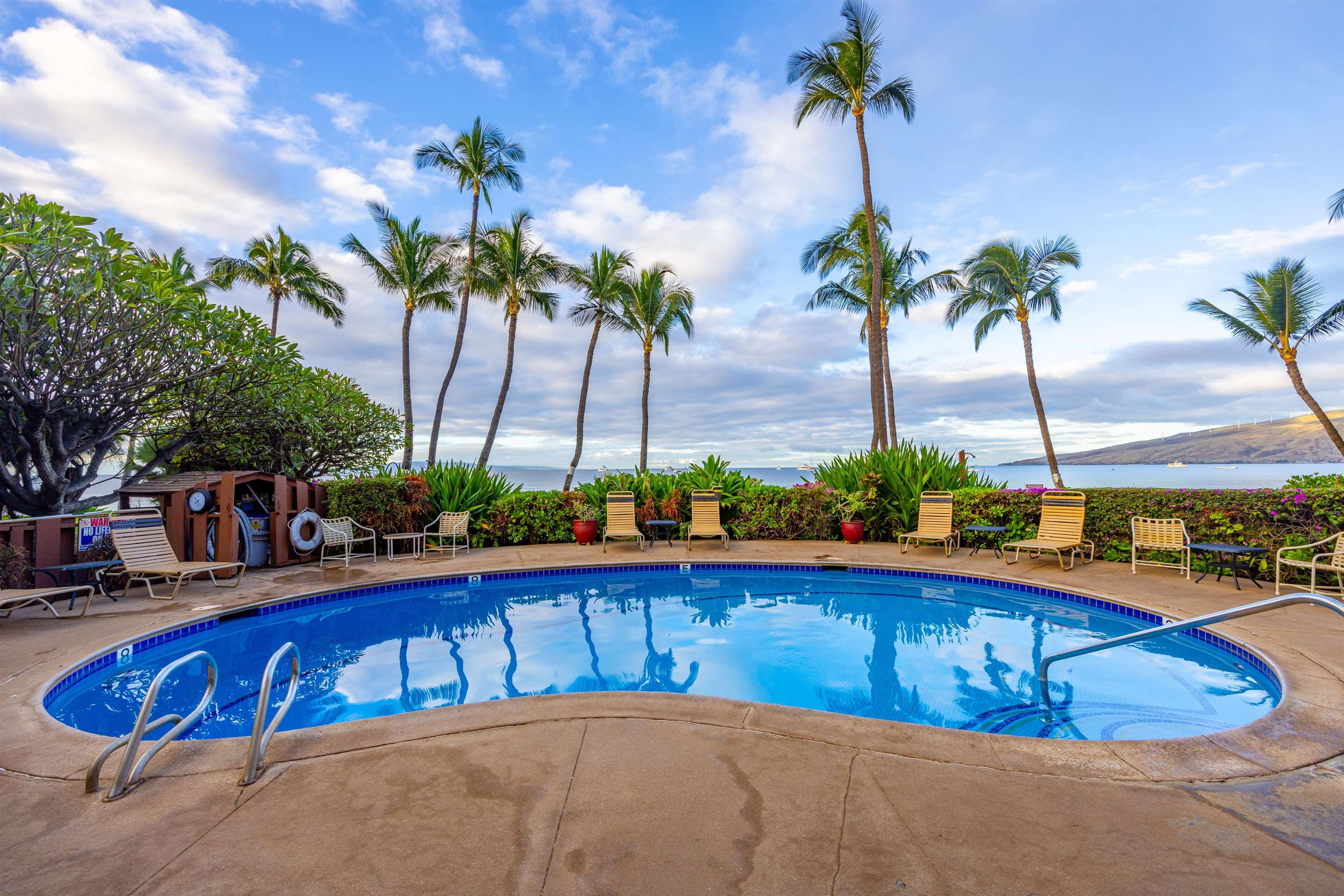 191 North Kihei Road, Unit 502 Kihei, HI 96753 - Photo 24 of 37 a view of swimming pool with a table and chairs