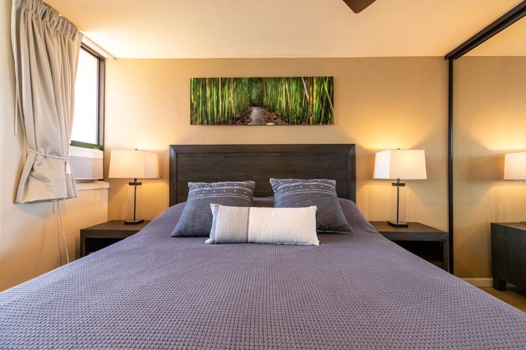 191 North Kihei Road, Unit 502 Kihei, HI 96753 - Photo 10 of 37 a bedroom with a bed and a fireplace