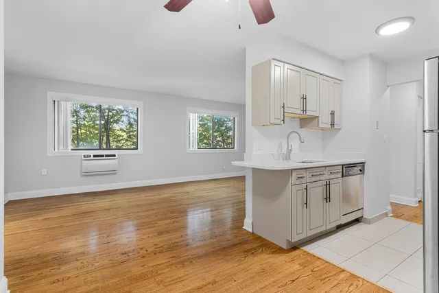 a kitchen with stainless steel appliances granite countertop a sink and a stove top oven