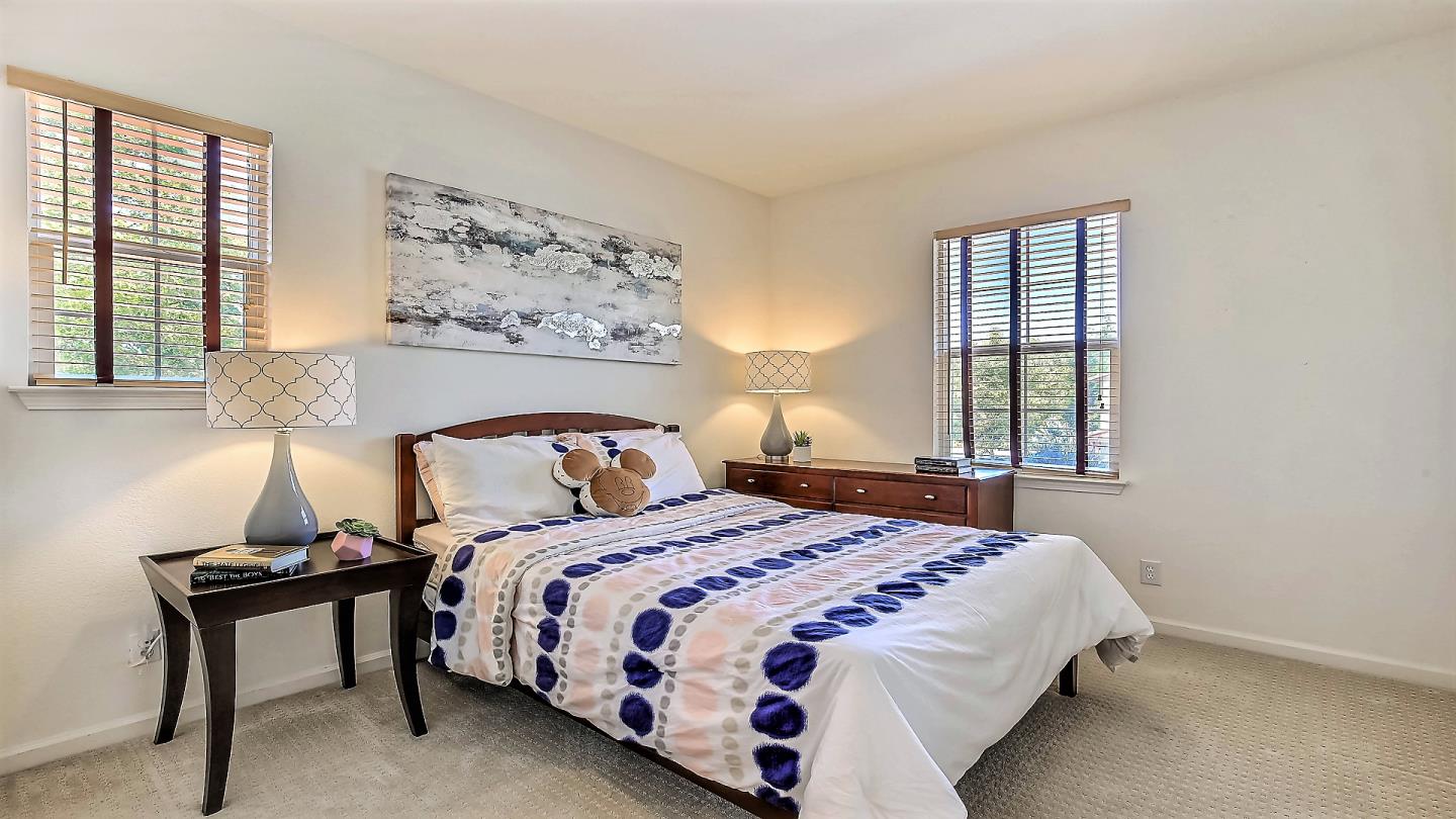 100 Mintaro Court San Ramon, CA 94582 - Photo 17 of 26 a bedroom with a bed and a painting on the wall