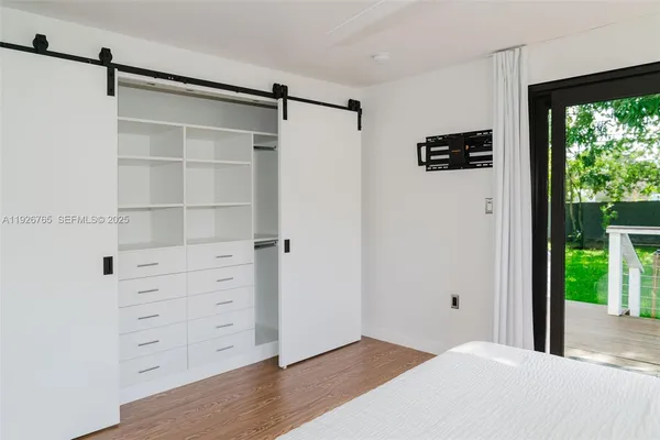 a view of room with window and cabinet