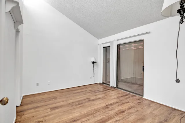 a close view of a sink a refrigerator and dresser