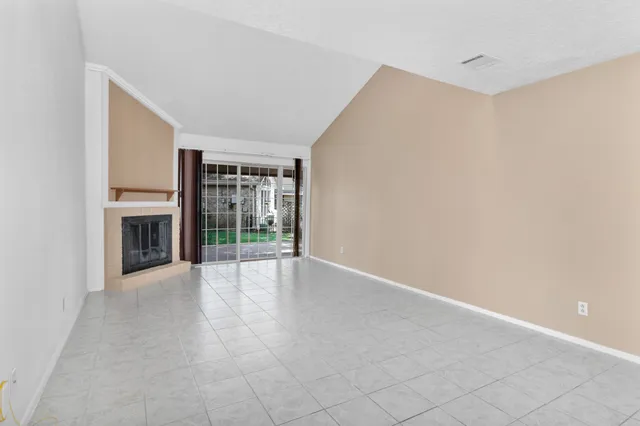 a view of a hallway with a chandelier